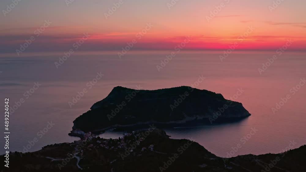 Greek island Kefalonia, sunset sky over assos village Greek island Kefalonia, sunset sky over assos village