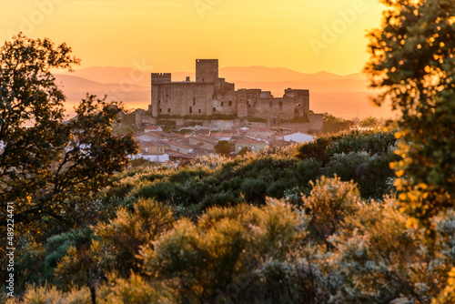 Ancient castle on old town under sundown sky