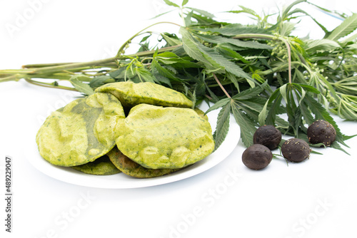 Green Poori Also Called Puri Is Made Of Maida Wheat Flour Edible Cannabis Leaves Also Called Bhaang Ke Patte Or Bhang Ka Patta. Consumed On Indian Festival Of Colors Holi. Isolated On White Background