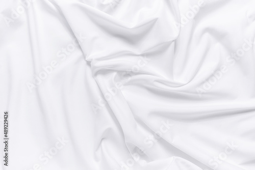 White fabric texture background. Cloth soft wave. Creases of satin, silk, and cotton.