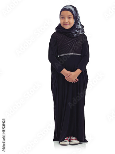 Teaching tradition. Studio portrait of a cute little muslim girl isolated on white.