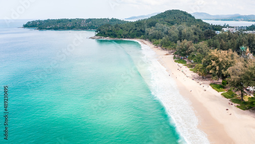 aerial view surin beach and small tourist on the sand beach at summer holiday Phuket Thailand