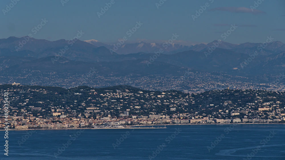 Aerial panoramic view of city Cannes at the French Riviera, southern France on the mediterranean coast below the Alpine mountains on sunny day.
