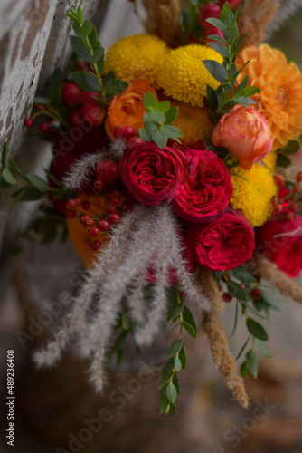 Wedding bouquet . The bride's bouquet. Bouquet of red flowers. Bridal douquet composed of dahlia and roses. photo