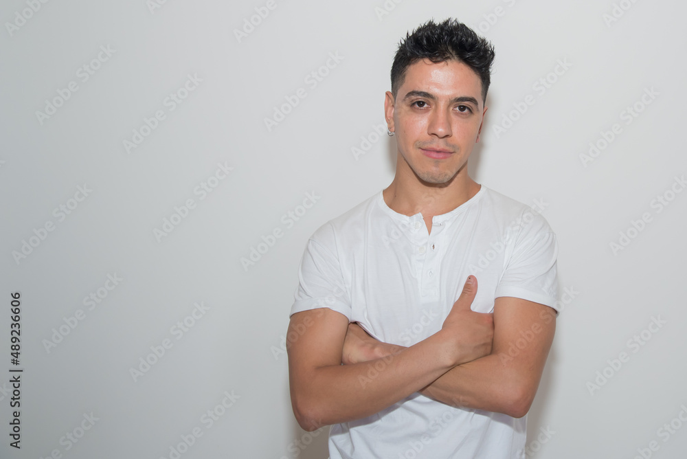 nice guy, dark-haired, white test, white t-shirt, looking straight ahead, neutral background nice guy, dark-haired, white test, white t-shirt, looking straight ahead, neutral background