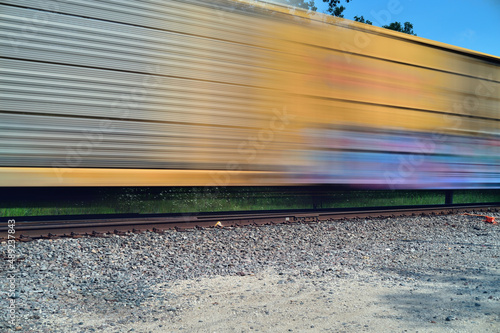 A freight train, blurred by its motion, passing through northeastern Illinois. Freight traffic in this part of the United States is especially heavy due to its proximity to Chicago.