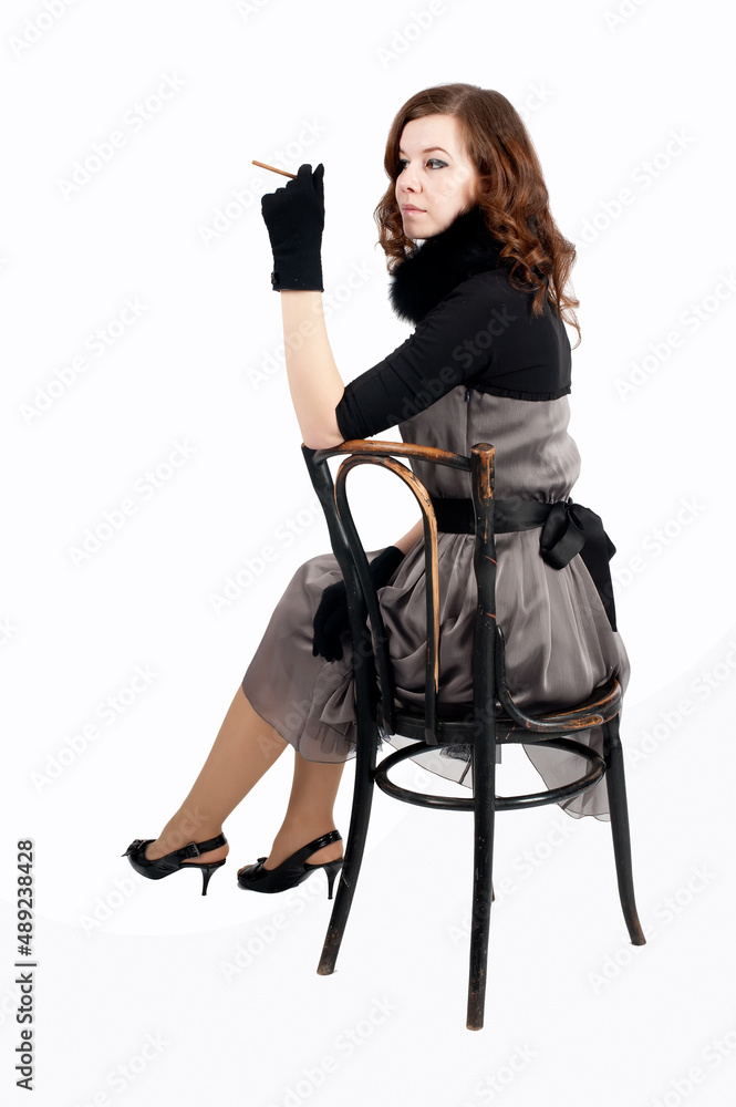Fototapeta premium Pretty woman on vintage chair