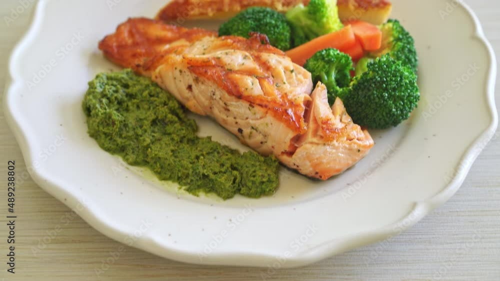 grilled salmon steak with pesto sauce and vegetable grilled salmon steak with pesto sauce and vegetable
