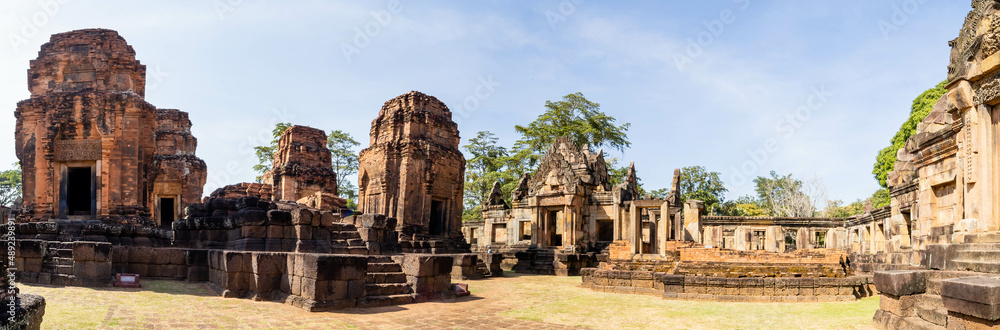 BURIRAM, THAILAND - December 4, 2021: Tourists visit the Khmer archaeological site of Prasat Muang Tam, Buriram Province, Thailand.
