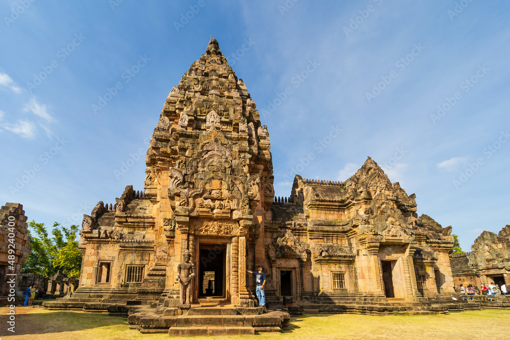 BURIRAM, THAILAND - December 4, 2021: Tourists visit Prasat Khao Phanom Rung is a stone laterite castle. Buriram Province, Thailand. BURIRAM, THAILAND - December 4, 2021: Tourists visit Prasat Khao Phanom Rung is a stone laterite castle. Buriram Province, Thailand.
