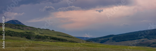 Panoramic view of rolling hills with evening sky near Crested Butte  Colorado