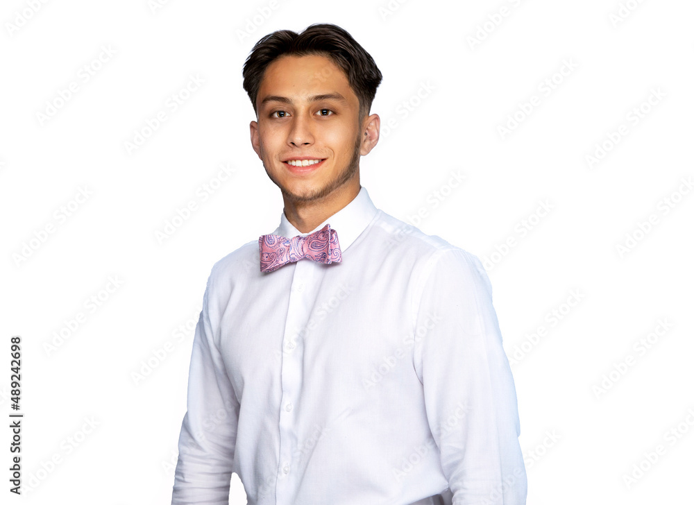 Latin man smiling wearing pink bow tie and white shirt against a white background Latin man smiling wearing pink bow tie and white shirt against a white background