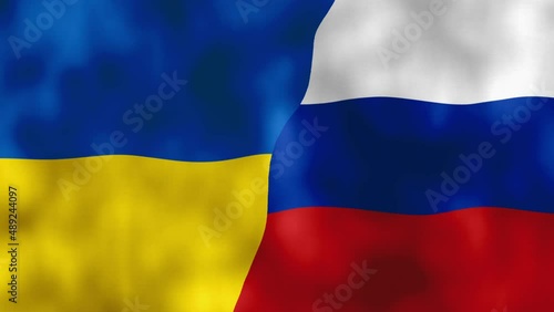 Ukraine and Russia flag waving in the wind, concept of war against each other photo