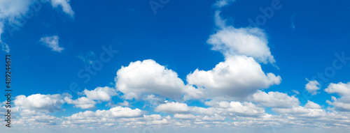 Blue Sky background with tiny Clouds. Panorama background © Pakhnyushchyy