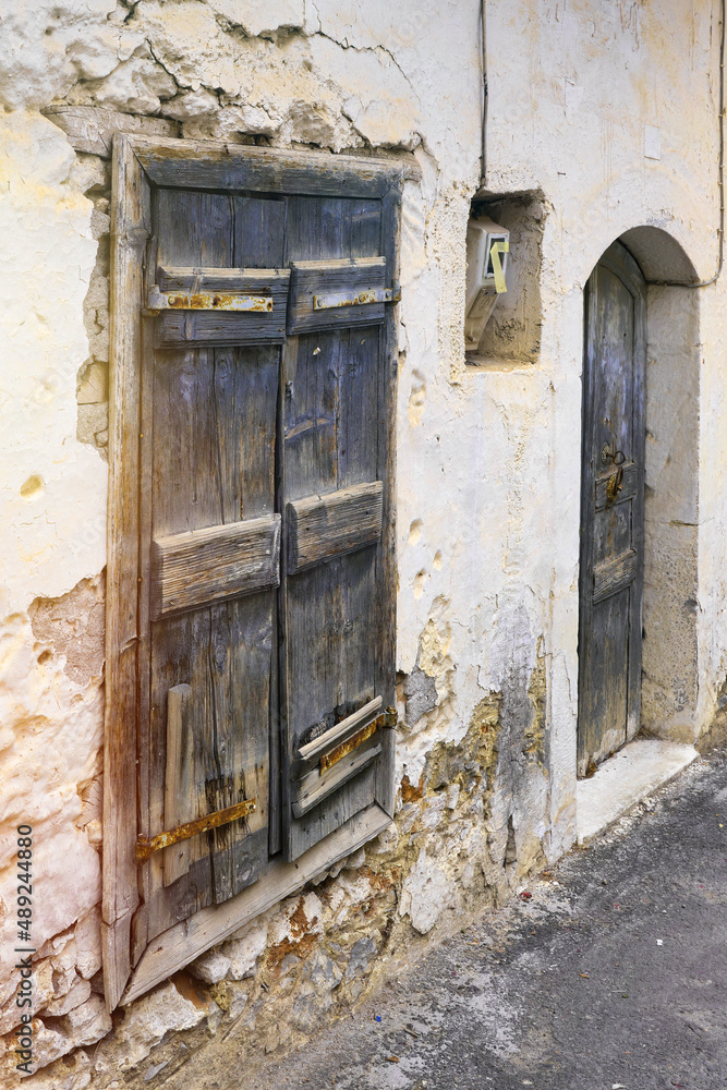 Very old wooden door and broken brickwork Very old wooden door and broken brickwork
