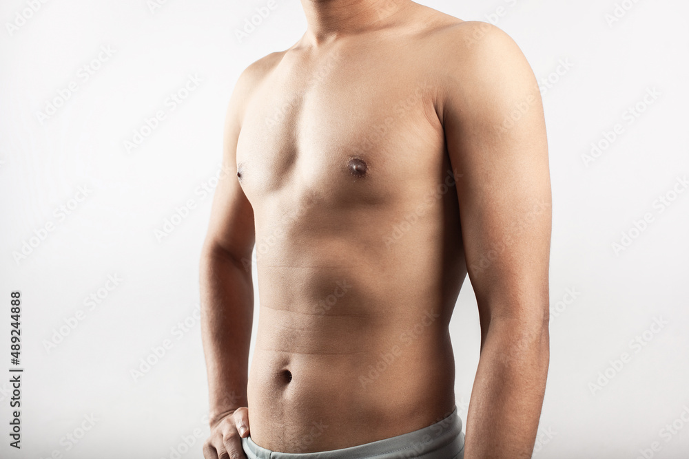 Fototapeta premium fitness man showing in front torso for slim belly