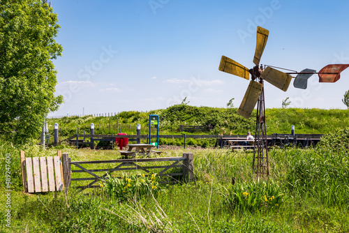 Landscape with littel water mill of island and nature reserve Tiengemeten Hoeksche Waard n South Holland in The neteherlands photo