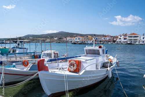 Traditional Fishing boat anchored at Elafonisos island port Greece. Sunny summer day