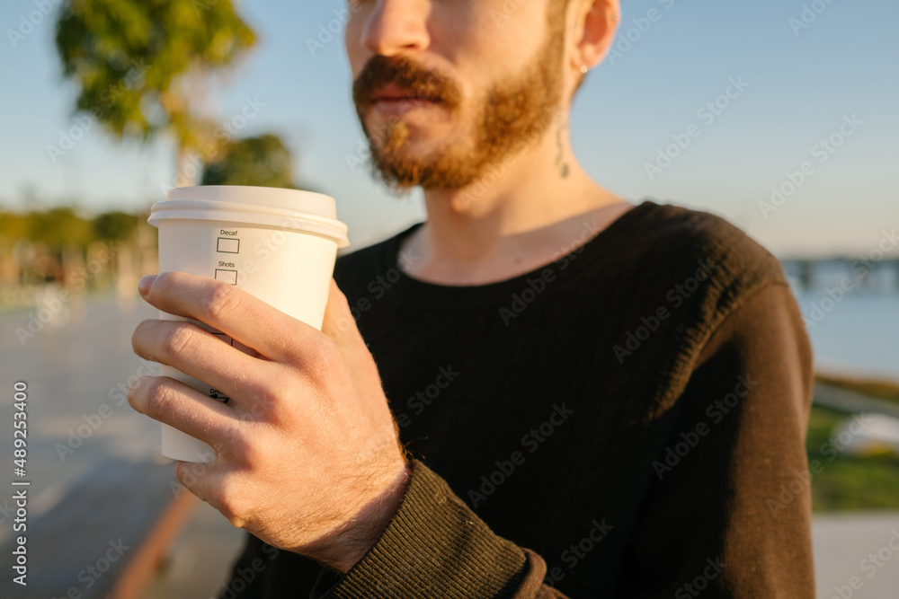 Coffee cup, young man is holding coffee cup, a third wave coffee maker and coffee cup, coffee terms on coffee mug Coffee cup, young man is holding coffee cup, a third wave coffee maker and coffee cup, coffee terms on coffee mug