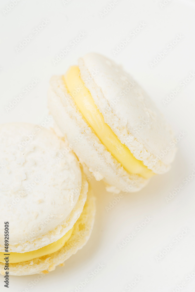 Vanilla macaroons with filling on table Vanilla macaroons with filling on table