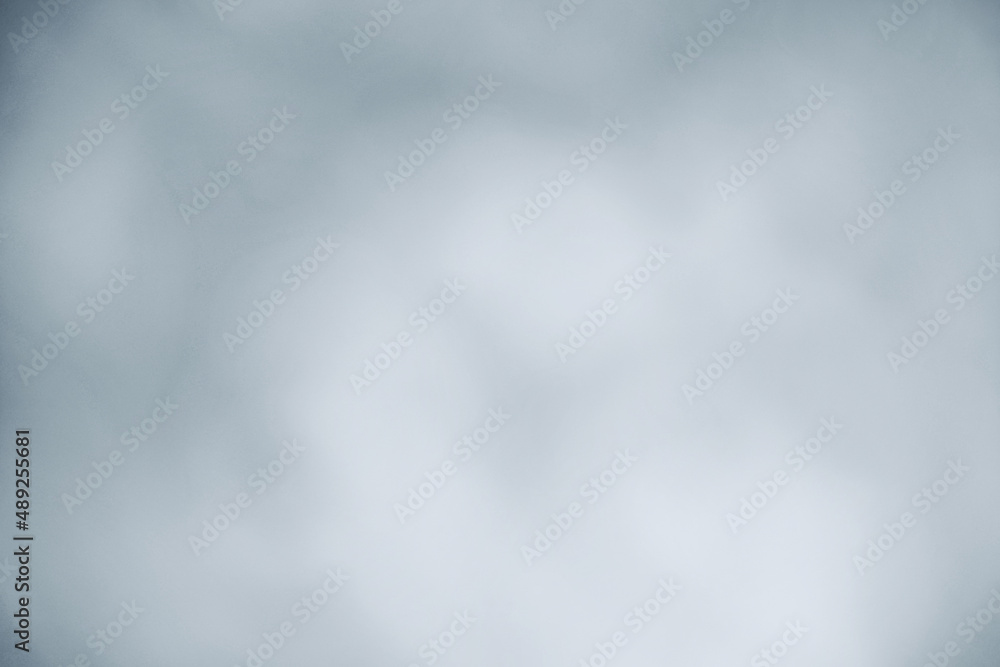Wolkenförmige Farbverläufe mit grau, weiß und blau als ein eleganter, schöner Hintergrund Wolkenförmige Farbverläufe mit grau, weiß und blau als ein eleganter, schöner Hintergrund