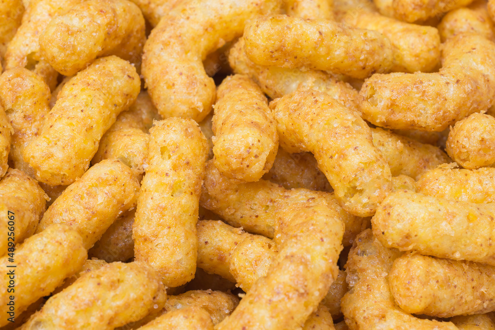 Full frame shot of crunchy peanut puffs. Food background Full frame shot of crunchy peanut puffs. Food background