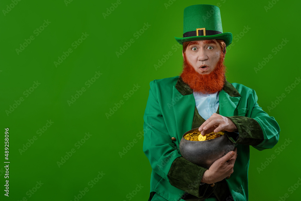 Leprechaun elf on St. Patrick's Day. Cheerful character Irish leprechaun  for advertising with a red natural