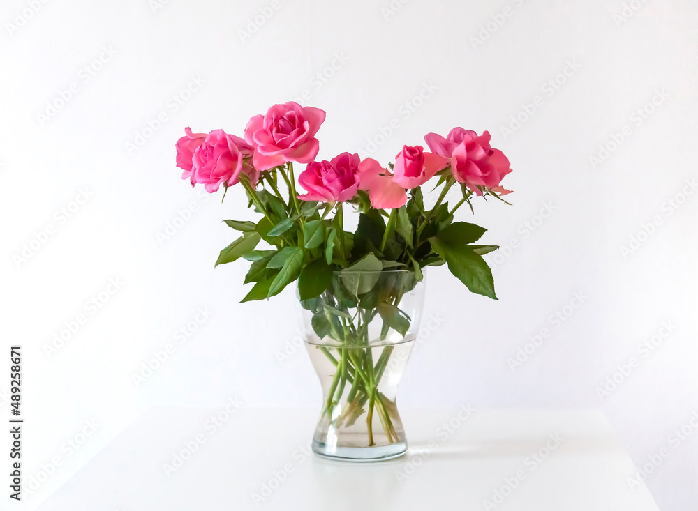 Bouquet of pink rose flowers in transparent vase. Bouquet of pink rose flowers in transparent vase.