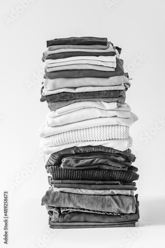 Folded colorful clothes. Home organizing. Domestic storage.