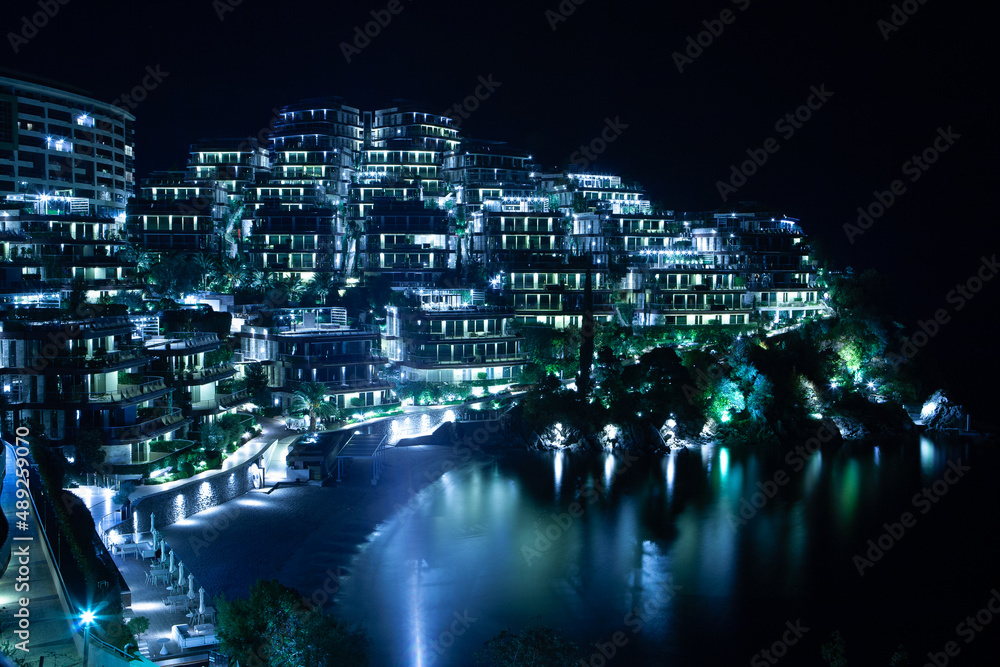 Night view to the Dukley of the Budva for publication, poster, calendar, post, screensaver, wallpaper, postcard, postcard, banner, cover, website. Night background of the city for design Night view to the Dukley of the Budva for publication, poster, calendar, post, screensaver, wallpaper, postcard, postcard, banner, cover, website. Night background of the city for design