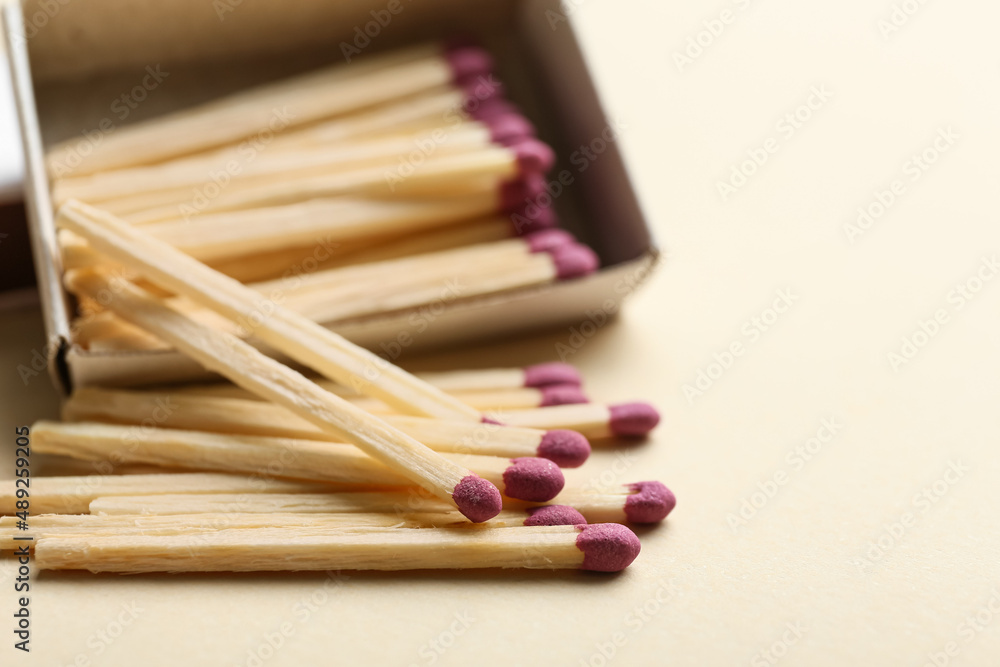 Matchbox with matches on color background, closeup