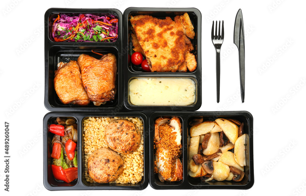 Lunch boxes with food and cutlery on white background Lunch boxes with food and cutlery on white background