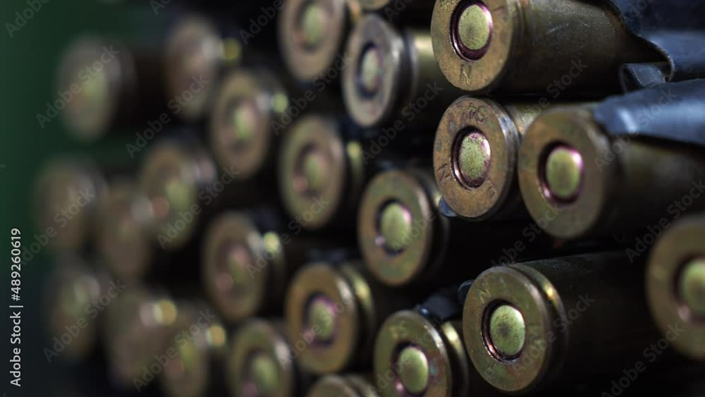 Cartridges from a machine gun on a black background. Cartridges from a machine gun on a black background.