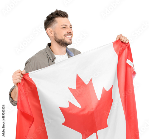 Happy young man with flag o...
