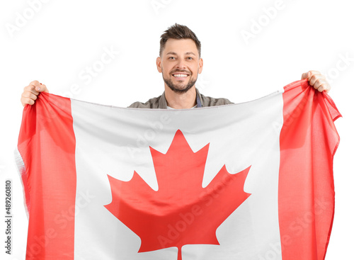 Happy young man with flag o...