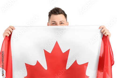Happy young man with flag o...