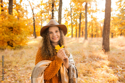 Woman with plaid holding au...