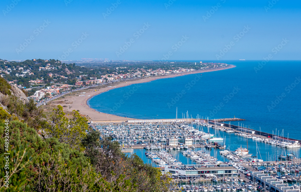 Views of Castelldefels and the beach, Port Ginesta harbor with sailing boats, near Barcelona, Spain