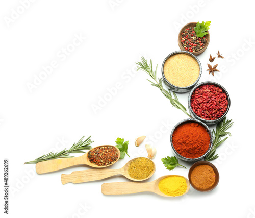 Composition with spices and herbs isolated on white background