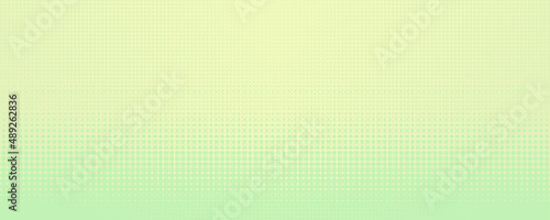 Pastel yellow and light green background in spring colors made with little dots