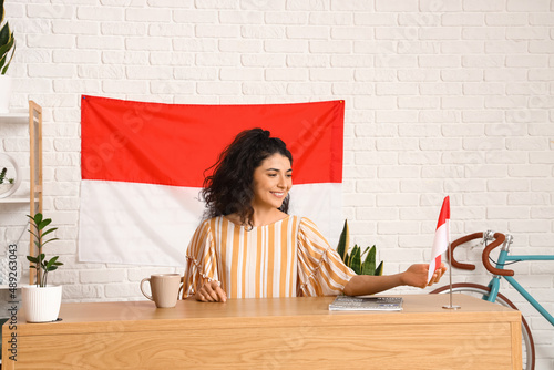 Young Asian woman sitting a...
