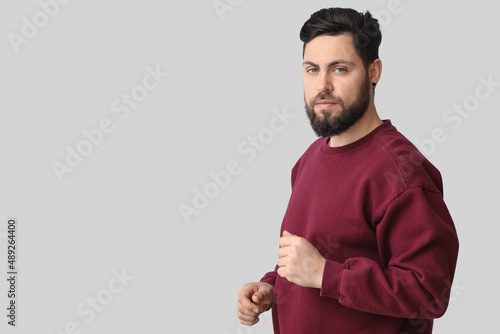 Stylish bearded man on ligh...