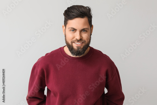 Stylish bearded man on ligh...