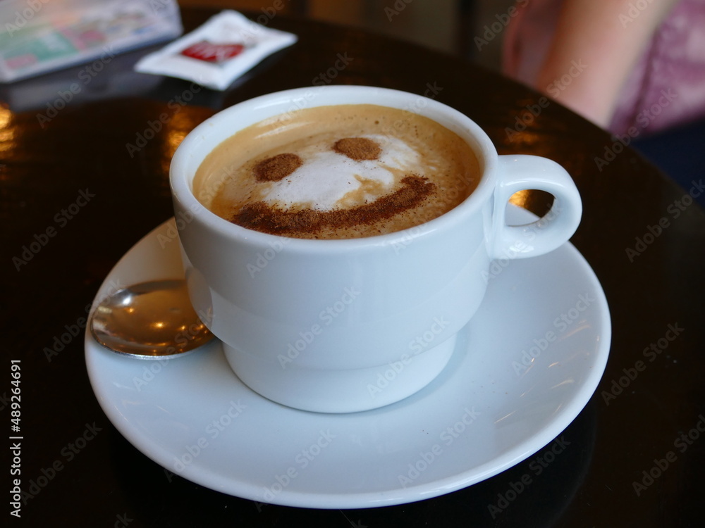 Smiley on a cup of cappuchino Smiley on a cup of cappuchino