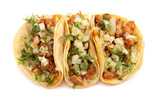 Three Spicy Chicken Street Tacos on a White Background