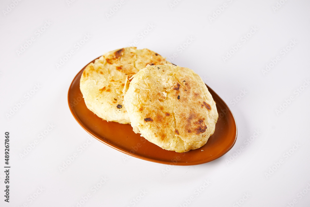 Tortilla de yuca a traditional Ecuadorian appetizer served with coffee. It’s on a white background. Tortilla de yuca a traditional Ecuadorian appetizer served with coffee. It’s on a white background.