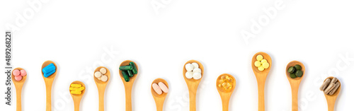 Obraz na płótnie Supplements and vitamins on a white background. Selective focus.