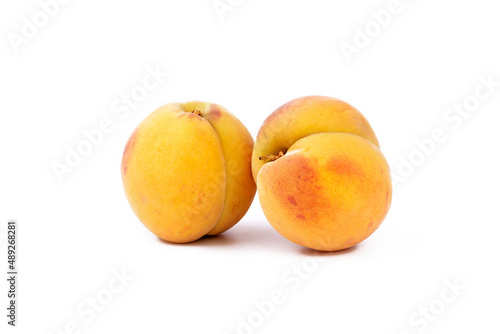 Ripe fresh peaches fruit isolated on white background.
