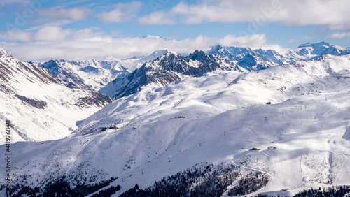 Scenic view of Livigno ski resoret in Sondrio province, Italy. Popular skiing resort in European Alps. Snowcapped mountain range
