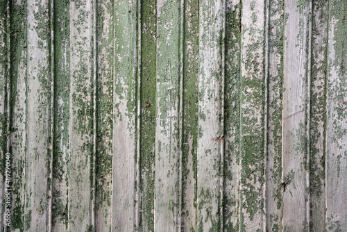 Background from old wooden boards (wooden beam). Vintage texture, background. Faded green color © kalichka